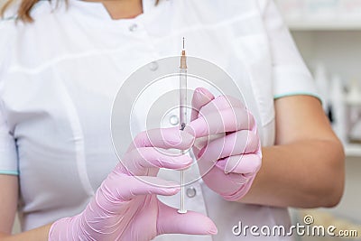 cosmetologist holds a syringe for injection. Stock Photo