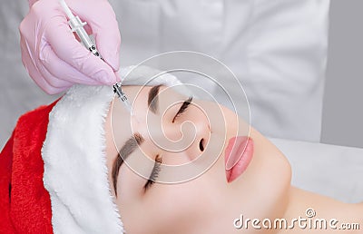 The cosmetologist makes the Botulinum toxin injection on the face skin Stock Photo