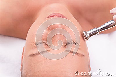 Woman while procedure jet peeling, facial treatmen Stock Photo