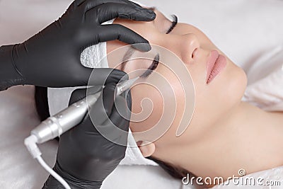 Cosmetologist making permanent makeup Stock Photo