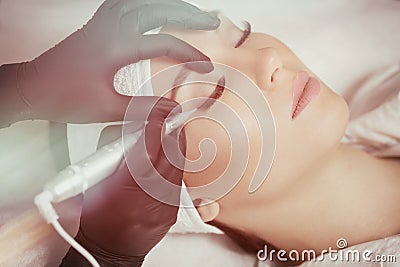 Cosmetologist making permanent makeup Stock Photo