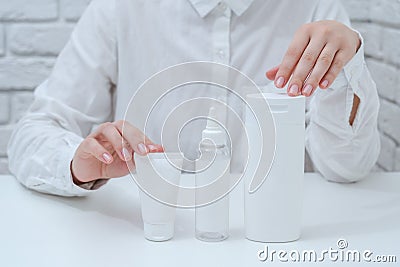 Cosmetology doctor offering cosmetic products. Packing tubes. Cosmetics, beauty and spa concept Stock Photo