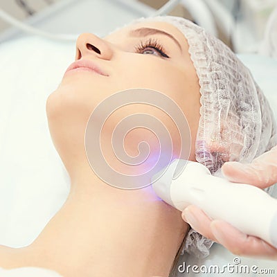 Cosmetology light equipment. Anti age and wrinkle. Microcurrent medicine treatment. Beauty woman. Sincare clinic. aesthetic peelin Stock Photo