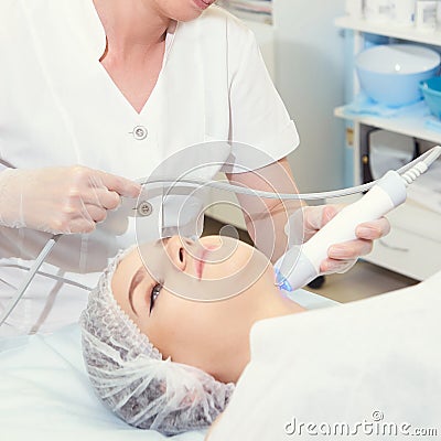 Cosmetology light equipment. Anti age and wrinkle. Microcurrent medicine treatment. Beauty woman. Sincare clinic. aesthetic peelin Stock Photo