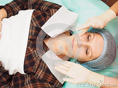 Cosmetology procedure mesoteraphy. Rejuvenation revitalization, skin nutrition, wrinkle reduction. Doctor making microneedle injec Stock Photo