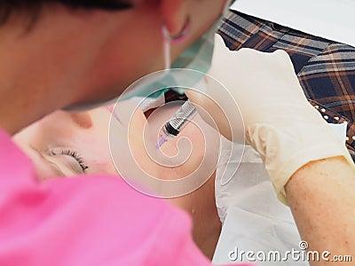 Cosmetology procedure mesoteraphy. Rejuvenation revitalization, skin nutrition, wrinkle reduction. Doctor making microneedle injec Stock Photo