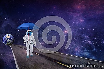 Cosmonaut space walk under an umbrella from planet Earth to the universe Stock Photo