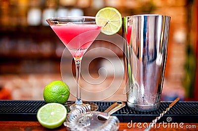 Cosmopolitan cocktail drink at casino and bar served with lime Stock Photo