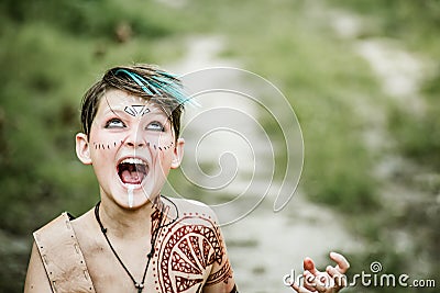 cosplay of Ukrainian Kozak. Cute Caucasian boy holding mace with emblem of Ukraine pretending to be fearless warrior Stock Photo