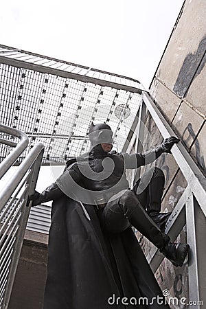 Cosplayer climbs with Batman costume Editorial Stock Photo