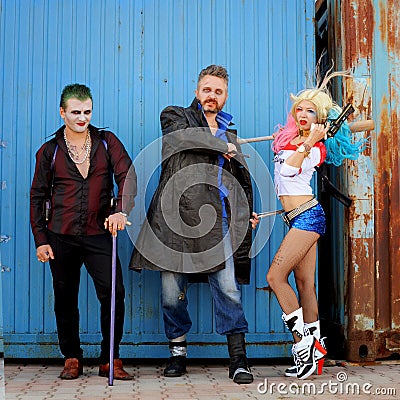 Cosplayer girl in Harley Quinn costume and cosplayer men in Joker and Boomerang Editorial Stock Photo