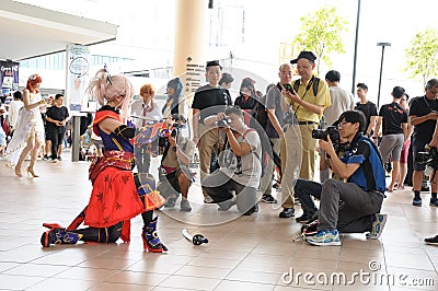 A Cosplayer posing for photo taking by amateur hobbyist photographers Editorial Stock Photo