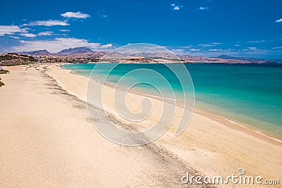 Costa Calma sandy beach with vulcanic mountains on Jandia peninsula, Fuerteventura island, Canary Islands, Spain. Stock Photo