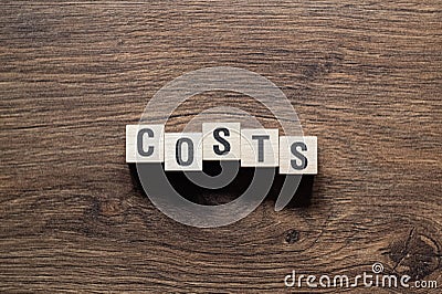 Costs - word concept on building blocks, text Stock Photo