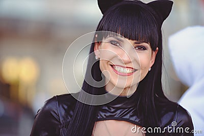 Costume of a beautiful young model wearing a cat costume. Hot sexy brunette cat-style female black fetish latex leather cat. Stock Photo