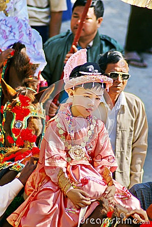 Costumed child on a horse in a parade in Myanmar Editorial Stock Photo