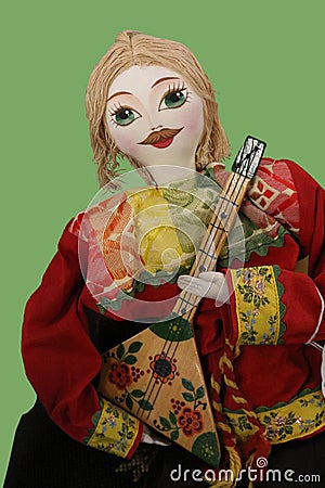 Costumed Doll Plays Mandolin Stock Photo