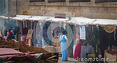 Costumed and public people discussing in the historic city center decorated for the Braga Romana Editorial Stock Photo