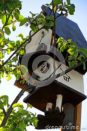 So cosy birdhouse on the top of a appletree in the spring garden Stock Photo