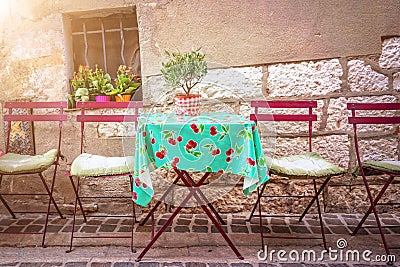 Cosy vintage cafe terrace in a street of Cassis on the French rivieria France Stock Photo