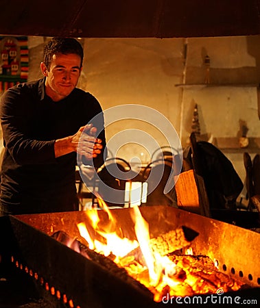 Cosy warm atmosphere in the Epoca de Piatra whine cellar during winter. Editorial Stock Photo