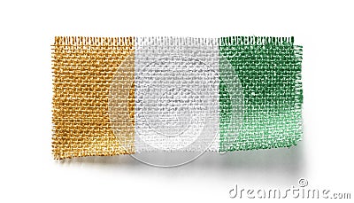 Cote dIvoire flag on a piece of cloth on a white background Stock Photo