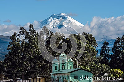 Cotopaxi volcano over the San Jaloma Church, Andes Stock Photo