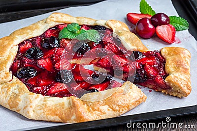 Cottage cheese dough galette with strawberry and cherry, horizontal Stock Photo