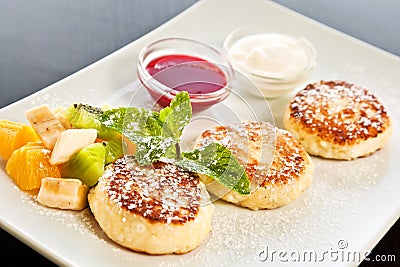 Cottage cheese pancakes with fruits Stock Photo