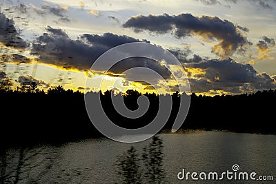 Cottage Country Sunset over Lake Stock Photo