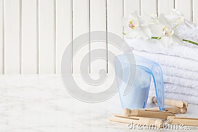 Cotton bath towels and washing powder Stock Photo