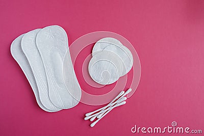 Cotton swabs and disks isolated on a pink background. Hygiene products Stock Photo