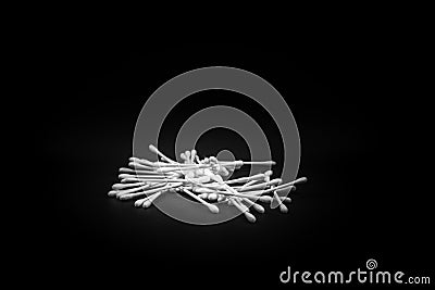 Cotton swabs up close scattered on a black background Stock Photo