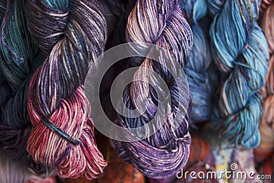 Cotton yarn. Hand-dyed threads. Modern tie dye. Diversified skeins for knitting Stock Photo