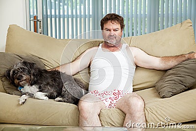 Couch Potato With His Dog Stock Photo
