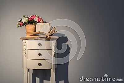 Couch table with flowers and book Stock Photo