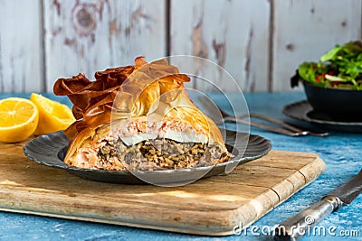 Coulibiac - salmon stuffed with rice, mushrooms,onion,dill and hard-boiled egg Stock Photo