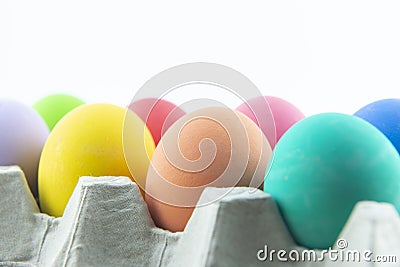 Coulourful eggs on the pack on white background Stock Photo