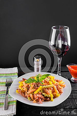 Coulourful pasta with wine Stock Photo