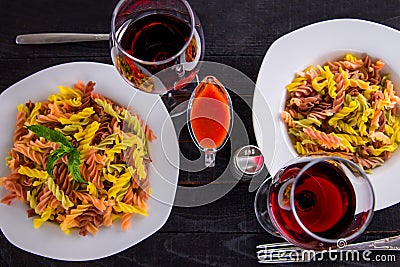 Coulourful pasta with wine Stock Photo