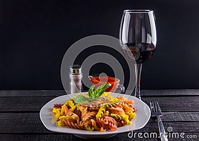 Coulourful pasta with wine Stock Photo