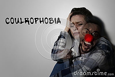 Coulrophobia concept. Double exposure of woman and clown Stock Photo