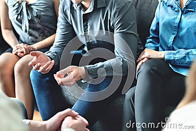 Counseling and conversation in group therapy or meeting. Man sharing story to community. Casual business people in discussion. Stock Photo