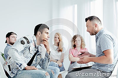 Counselor and problematic young man Stock Photo