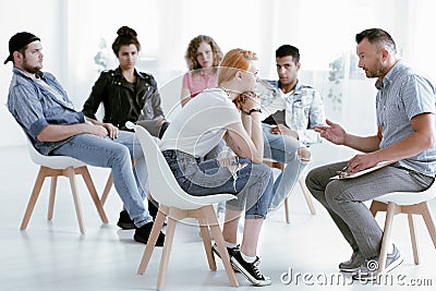 Counselor talking with rebellious girl Stock Photo