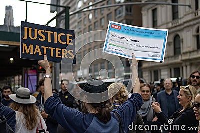 Counter Protester with Anti Trump Signs Outside the Courthouse during the Trump Indictment in New York City Editorial Stock Photo