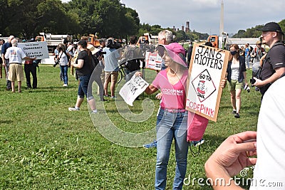 Counter Protester Holds Signs Opposing January 6th Insurrection at the Justice for J6 Protest Editorial Stock Photo