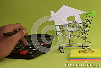 Counting house price, home insurance cost, property value or rent on paper. Stock Photo