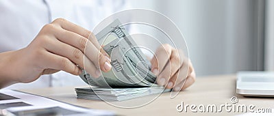 Counting money, businessmen have analyzed between cash and credit card which is consistent and convenient to spend in the present Stock Photo