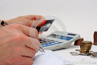 Counting money using calculator Stock Photo